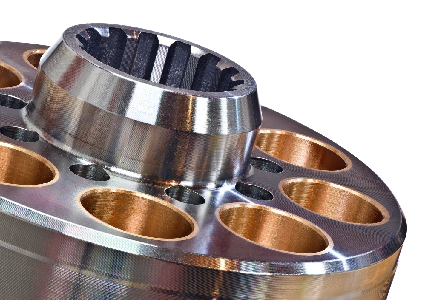 Close-up of a polished metal component featuring intricate holes and a textured interior, showcasing engineering precision and design.